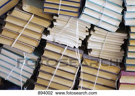 Stacks of tied up books View Large Photo Image Stock Image - Stacks of tied up books. Fotosearch