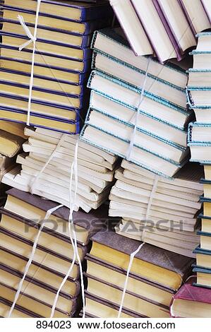 Stacks of tied up books View Large Photo Image Stock Image - Stacks of tied up books. Fotosearch