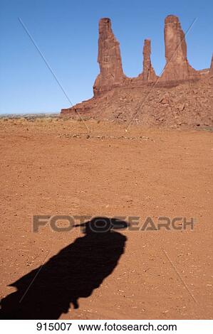 The shadow of a cowboy near Three Sisters View Large Photo Image Stock Photo - The shadow of a cowboy near Three Sisters . Fotosearch
