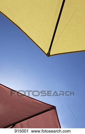 Two beach umbrellas, close-up, directly below View Large Photo Image Stock Image - Two beach umbrellas, close-up, directly below. Fotosearch