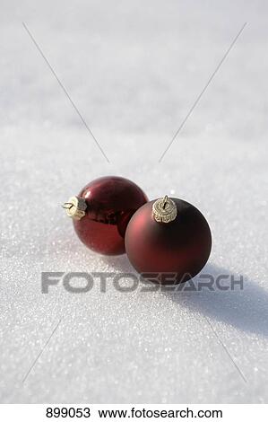 Two Christmas ball ornaments on the snow View Large Photo Image Stock Image - Two Christmas ball ornaments on the snow. Fotosearch