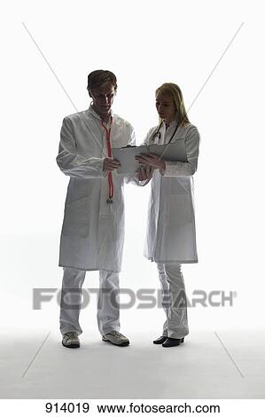 Two doctors consulting View Large Photo Image Stock Photo - Two doctors consulting . Fotosearch