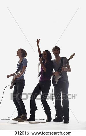 Two guitarists and a singer performing, studio shot, white background, back lit View Large Photo Image Stock Photography - Two guitarists and a singer performing, studio shot, white background, back lit. Fotosearch