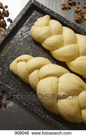 Stock Photograph - Two loaves of braided bread waiting to be baked. Fotosearch