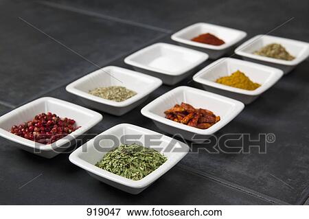 Various herbs and spices in small bowls View Large Photo Image Stock Photo - Various herbs and spices in small bowls. Fotosearch