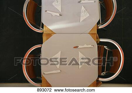 View from above of tables set in a restaurant View Large Photo Image Stock Image - View from above of tables set in a restaurant. Fotosearch