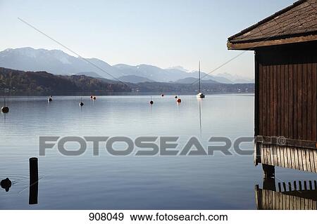 View of lake and mountains, Woerthersee, Carinthia, Austria View Large Photo Image Stock Photo - View of lake and mountains, Woerthersee, Carinthia, Austria. Fotosearch