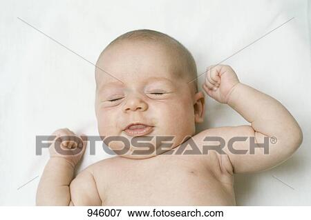 A baby stretching View Large Photo Image Stock Photo - A baby stretching. Fotosearch