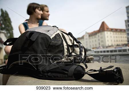 A backpack and a young couple by the Spree river, Berlin, Germany, focus on backpack View Large Photo Image Stock Image - A backpack and a young couple by the Spree river, Berlin, Germany, focus on backpack. Fotosearch