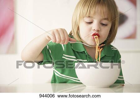 A boy eating spaghetti View Large Photo Image Stock Photograph - A boy eating spaghetti. Fotosearch