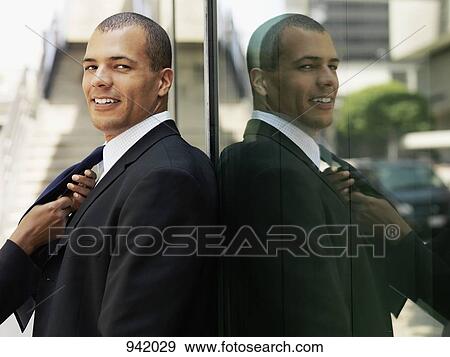 A businessman having his tie tied but his girlfriend View Large Photo Image Stock Photo - A businessman having his tie tied but his girlfriend. Fotosearch