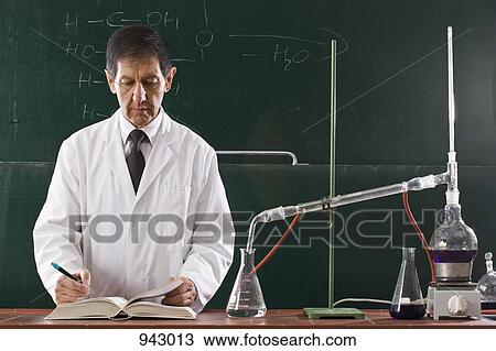 A chemistry teacher conducting an experiment in a classroom View Large Photo Image Stock Image - A chemistry teacher conducting an experiment in a classroom. Fotosearch