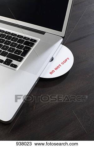 A disk with DO NOT COPY on it being inserted into a laptop View Large Photo Image Stock Image - A disk with DO NOT COPY on it being inserted into a laptop. Fotosearch