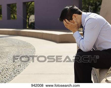 A distraught businessman with his head in hands View Large Photo Image Stock Photo - A distraught businessman with his head in hands. Fotosearch