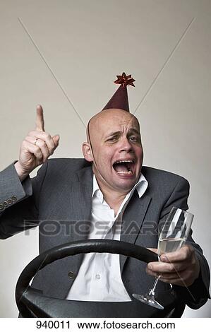 A drunk man behind a car steering wheel View Large Photo Image Stock Image - A drunk man behind a car steering wheel. Fotosearch