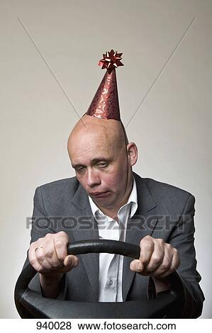 A drunk man behind a car steering wheel View Large Photo Image Stock Photo - A drunk man behind a car steering wheel. Fotosearch