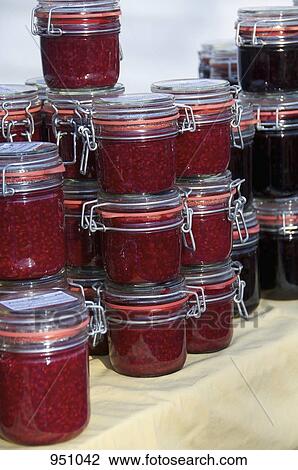 A farmer's market stall selling jars of homemade jam View Large Photo Image Stock Image - A farmer's market stall selling jars of homemade jam. Fotosearch