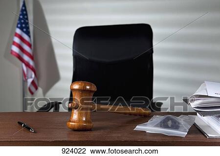 A gavel on a judge's desk in an empty courtroom View Large Photo Image Stock Image - A gavel on a judge's desk in an empty courtroom. Fotosearch