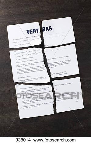 Picture - A German sales contract torn into pieces. Fotosearch