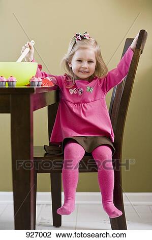 A girl playing with toy food and cooking utensils View Large Photo Image Stock Image - A girl playing with toy food and cooking utensils. Fotosearch