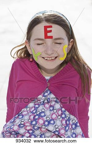 A girl with felt letters spelling YES on her face View Large Photo Image Stock Image - A girl with felt letters spelling YES on her face. Fotosearch