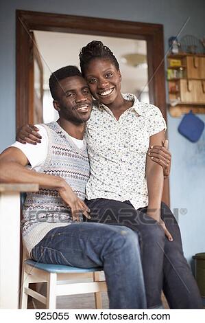 A girlfriend sitting on her boyfriend's lap View Large Photo Image Stock Photography - A girlfriend sitting on her boyfriend's lap. Fotosearch