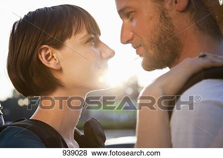 Stock Photo - A loving young couple, face to face, close-up. Fotosearch