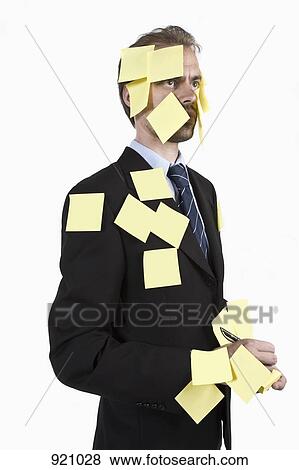 A man covered in blank adhesive notes and holding a pen View Large Photo Image Stock Photo - A man covered in blank adhesive notes and holding a pen. Fotosearch