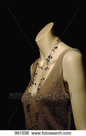 Stock Photograph - A mannequin wearing a glamorous top. Fotosearch