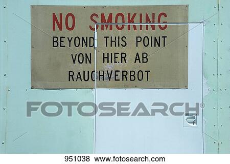 Stock Photo - A no smoking sign in German and English. Fotosearch