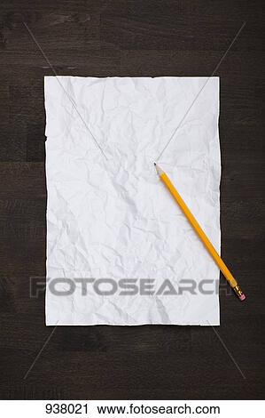 A pencil and a crumpled piece of paper flattened back out View Large Photo Image Stock Image - A pencil and a crumpled piece of paper flattened back out. Fotosearch