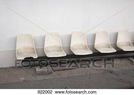 A row of empty seats, outdoors View Large Photo Image Stock Image - A row of empty seats, outdoors. Fotosearch