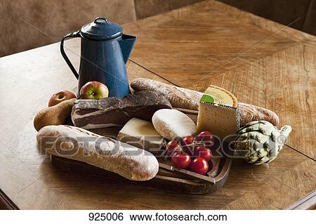 A simple rustic meal on a wood table View Large Photo Image Stock Photograph - A simple rustic meal on a wood table. Fotosearch