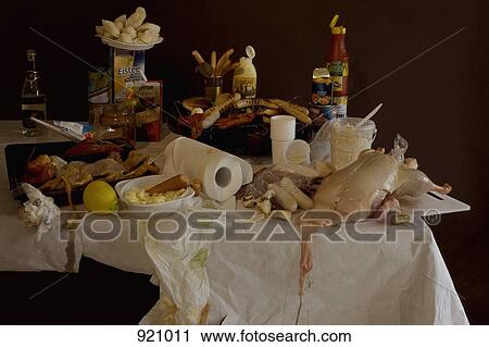 A table with a grill and an excess of various grilling meats and barbecue foods, still life View Large Photo Image Stock Image - A table with a grill and an excess of various grilling meats and barbecue foods, still life. Fotosearch