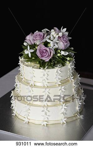 A tiered wedding cake View Large Photo Image Stock Image - A tiered wedding cake. Fotosearch