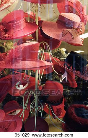 A variety of red hats on display in a hat shop View Large Photo Image Stock Photo - A variety of red hats on display in a hat shop. Fotosearch