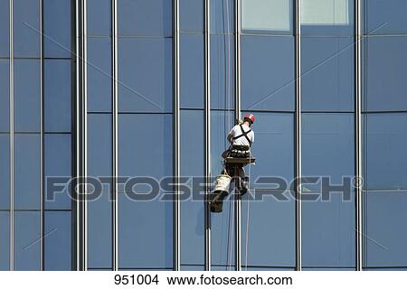 A window washing the windows of an office building View Large Photo Image Picture - A window washing the windows of an office building. Fotosearch