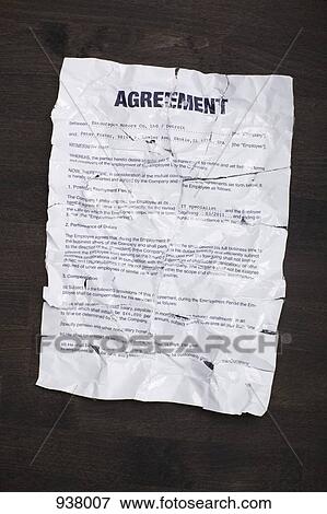 A wrinkled, torn employment agreement taped together and flattened out View Large Photo Image Stock Photo - A wrinkled, torn employment agreement taped together and flattened out. Fotosearch