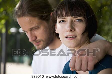 A young couple, head and shoulders, close-up, focus on woman View Large Photo Image Stock Image - A young couple, head and shoulders, close-up, focus on woman. Fotosearch