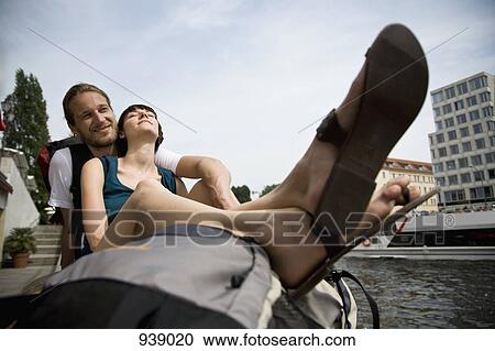 A young couple relaxing by the Spree river, Berlin, Germany View Large Photo Image Stock Image - A young couple relaxing by the Spree river, Berlin, Germany. Fotosearch