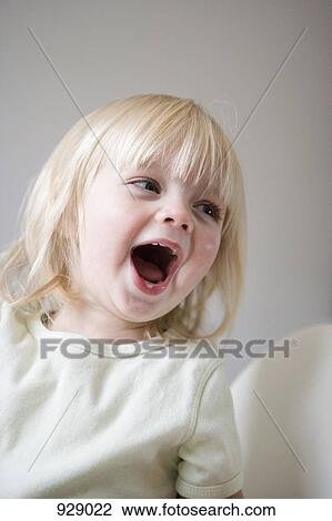 A young girl laughing View Large Photo Image Stock Image - A young girl laughing. Fotosearch