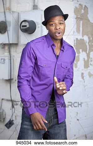 Picture - A young man singing. Fotosearch