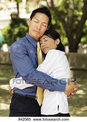 An affectionate businessman and businesswoman View Large Photo Image Stock Photography - An affectionate businessman and businesswoman. Fotosearch
