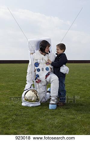Stock Photo - An astronaut and a little boy. Fotosearch