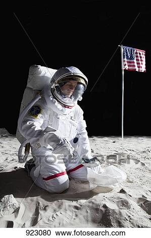 An astronaut on the moon collecting a soil sample View Large Photo Image Stock Image - An astronaut on the moon collecting a soil sample. Fotosearch