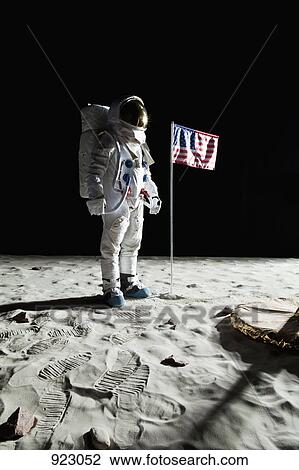 An astronaut on the moon standing next to an American flag View Large Photo Image Stock Image - An astronaut on the moon standing next to an American flag. Fotosearch