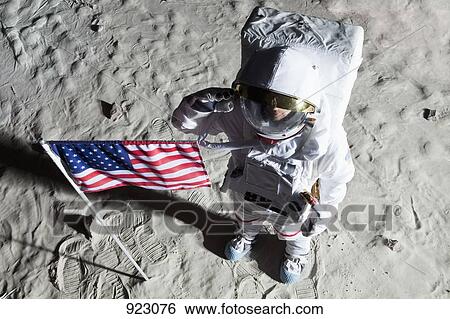 An astronaut on the surface of the moon saluting an American flag View Large Photo Image Stock Photograph - An astronaut on the surface of the moon saluting an American flag. Fotosearch