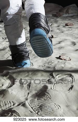 An astronaut walking on the moon, rear view, low section View Large Photo Image Stock Photography - An astronaut walking on the moon, rear view, low section. Fotosearch