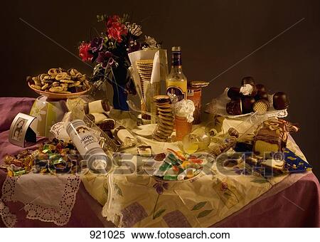 Stock Photography - An excess of candy and sweets on a table, still life. Fotosearch