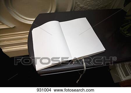 Picture - An open blank guest book. Fotosearch